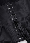 Load image into Gallery viewer, Close-up of a black corset with metal hooks on a white background