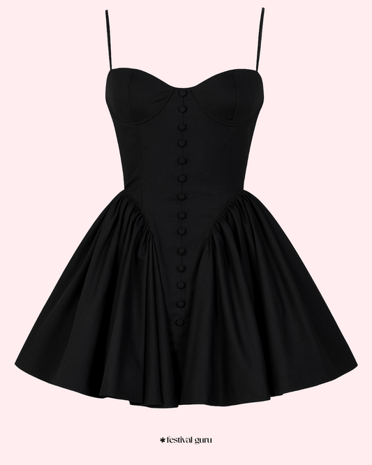 Black dress with button details on a white background