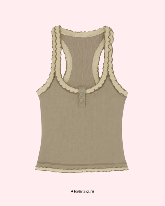 Brown tank top with lace trim on a light pink background