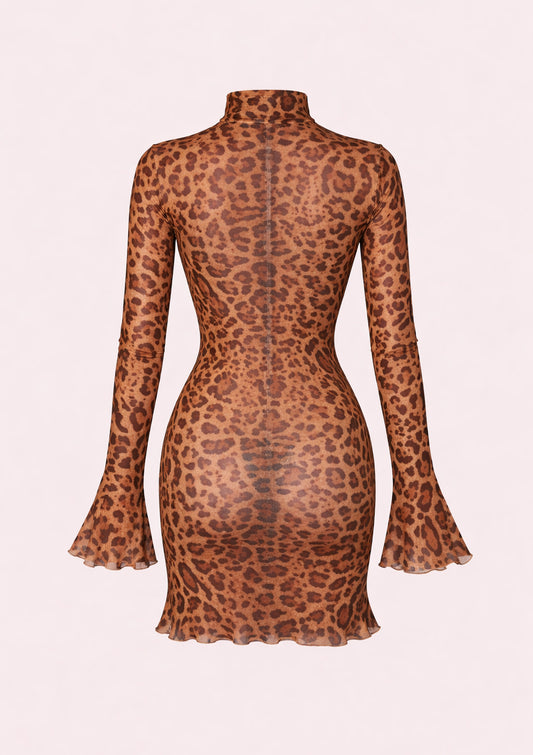 Leopard print dress with long sleeves on a light pink background
