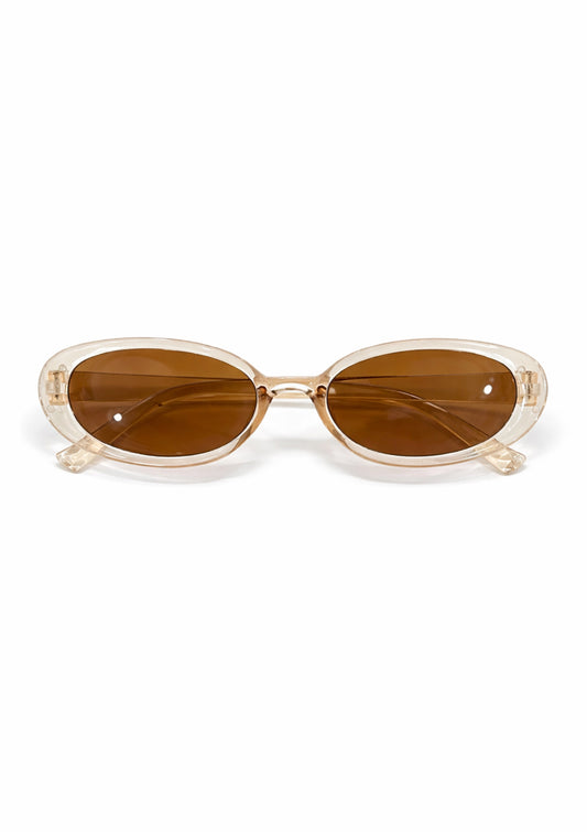 Sunglasses with a clear frame and brown lenses on a white background