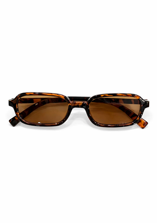 Sunglasses with tortoiseshell frame and brown lenses on a white background