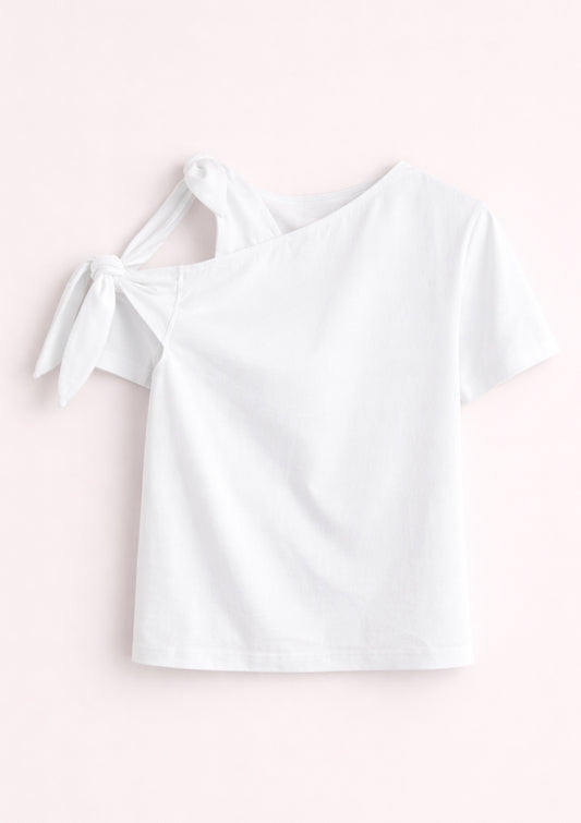 White off-shoulder top on a light pink background