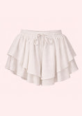 Load image into Gallery viewer, White shorts with ruffled layers on a light pink background