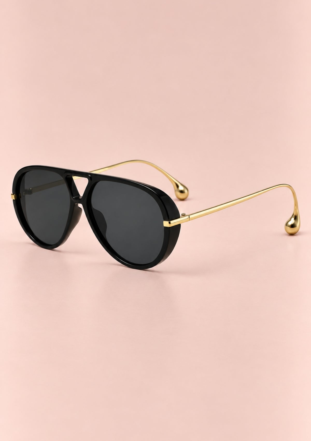 A pair of aviator sunglasses with silver metal frames and mirrored gray lenses, shown from a three-quarters angle on a plain white background.