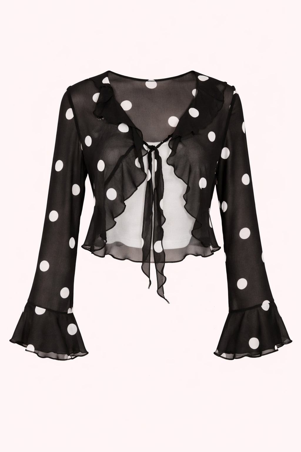 Black blouse with white polka dots on a white background