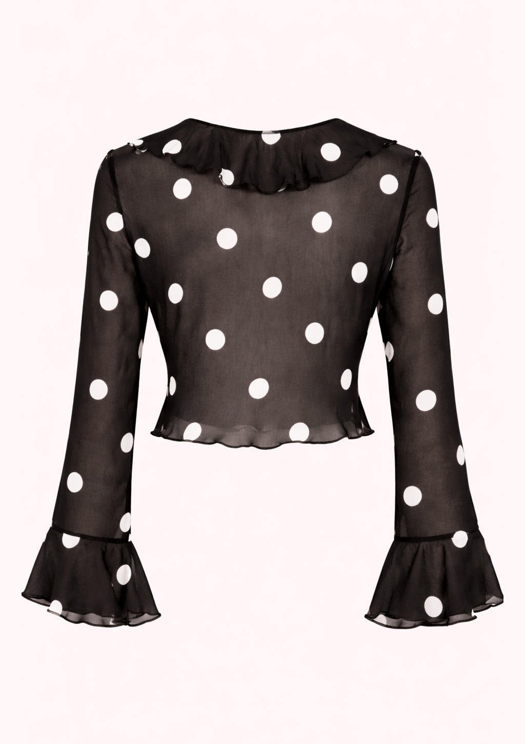Black blouse with white polka dots and ruffled sleeves on a white background