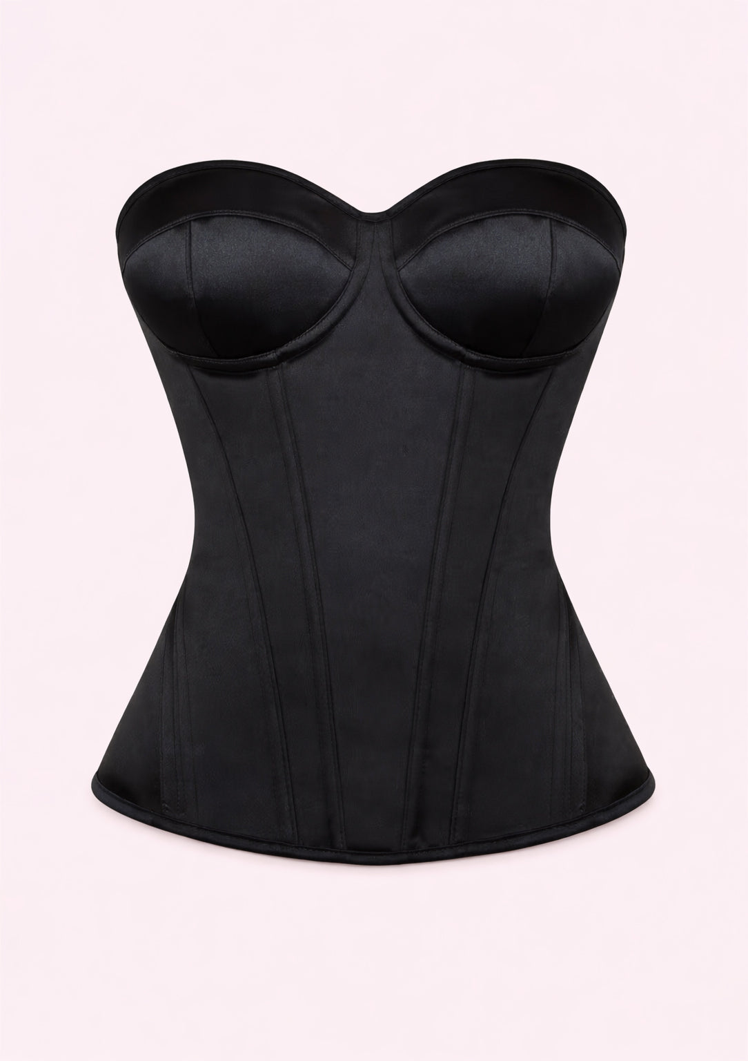 Black corset on a light pink background