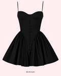 Black dress with button details on a white background