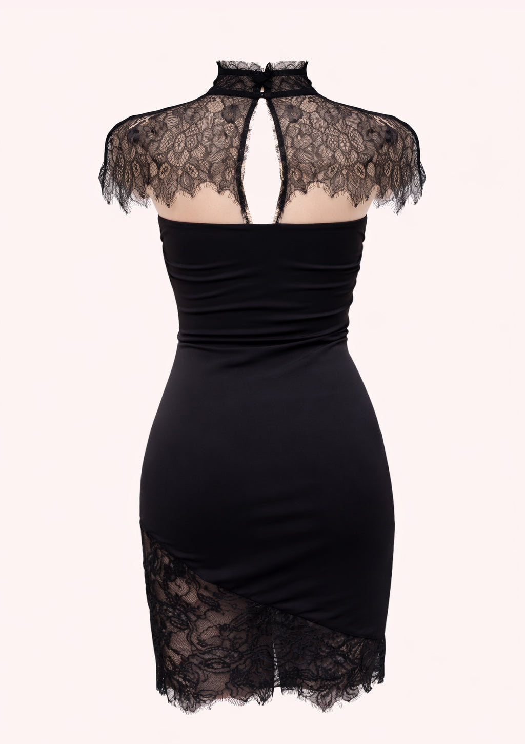 Black dress with lace detailing on a white background
