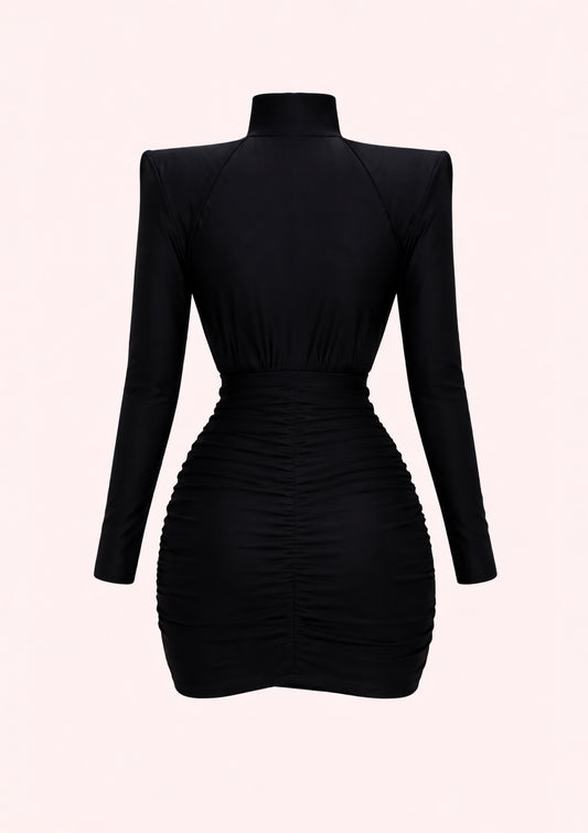 Black dress with long sleeves on a light pink background