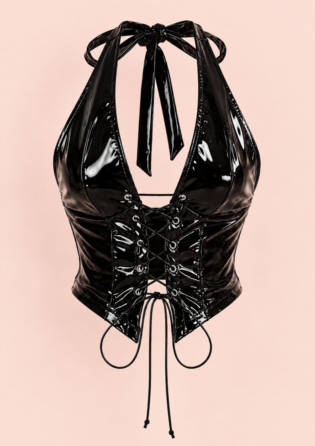 A glossy black patent leather halter top with a front lace-up corset closure, photographed against a solid pale pink background.