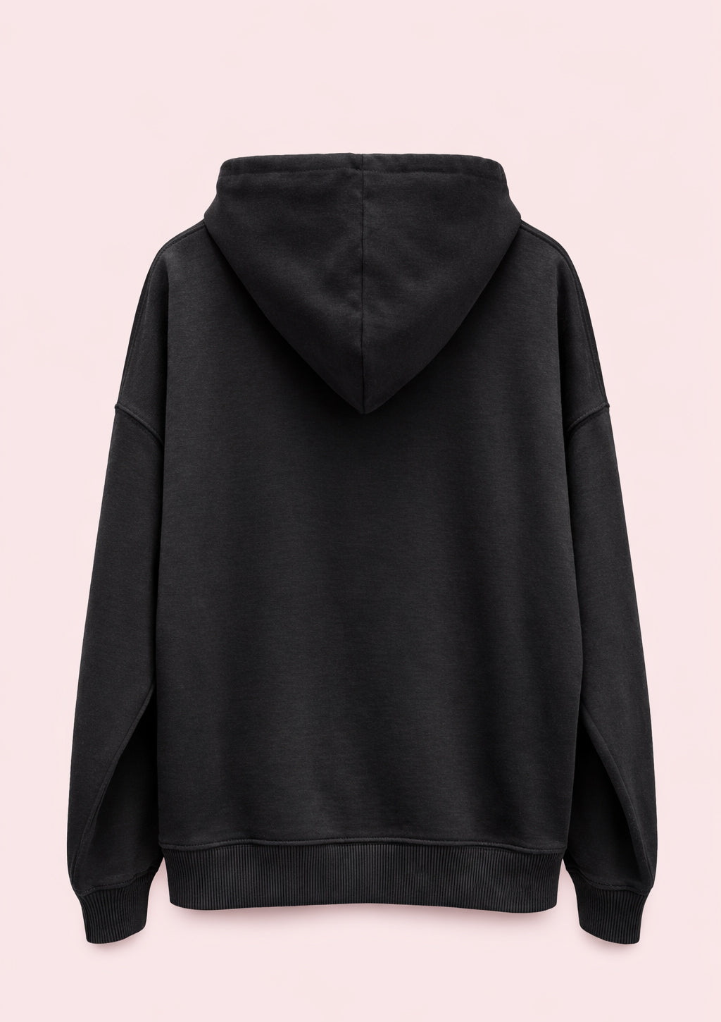 Black hoodie on a light pink background