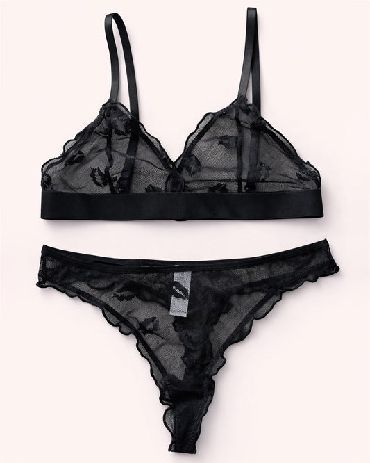Black lace lingerie set on a white background