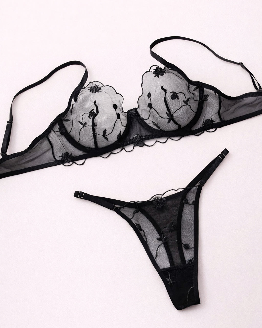 Black lace lingerie set on a white background
