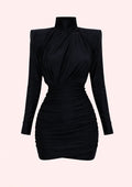 Black long-sleeve dress on a light pink background