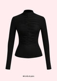 Заредете изображението в програмата за преглед на галерия, Black long-sleeve top with ruched design on a light pink background
