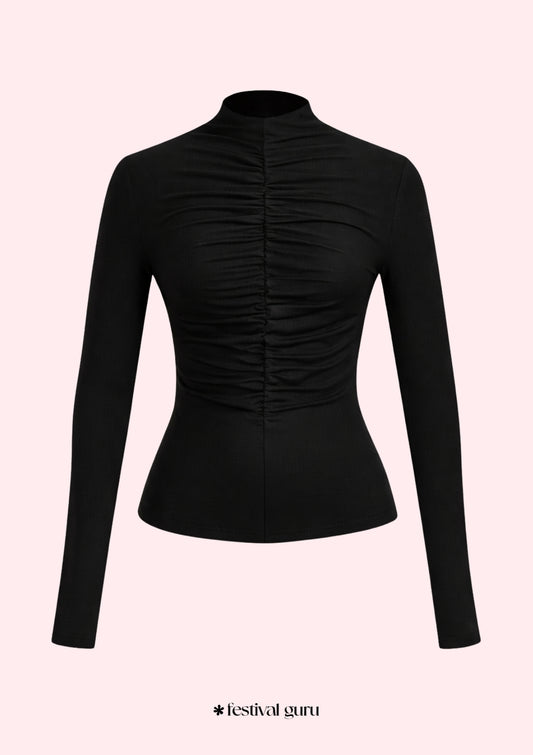 Black long-sleeve top with ruched design on a light pink background