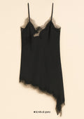 Black slip dress with lace trim on a beige background, branded 'festival guru'.