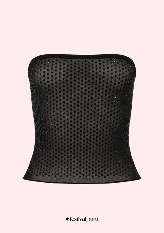 Black strapless top with rhinestone embellishments on a light pink background