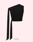 Заредете изображението в програмата за преглед на галерия, Black one-shoulder top with a tie detail on a light pink background
