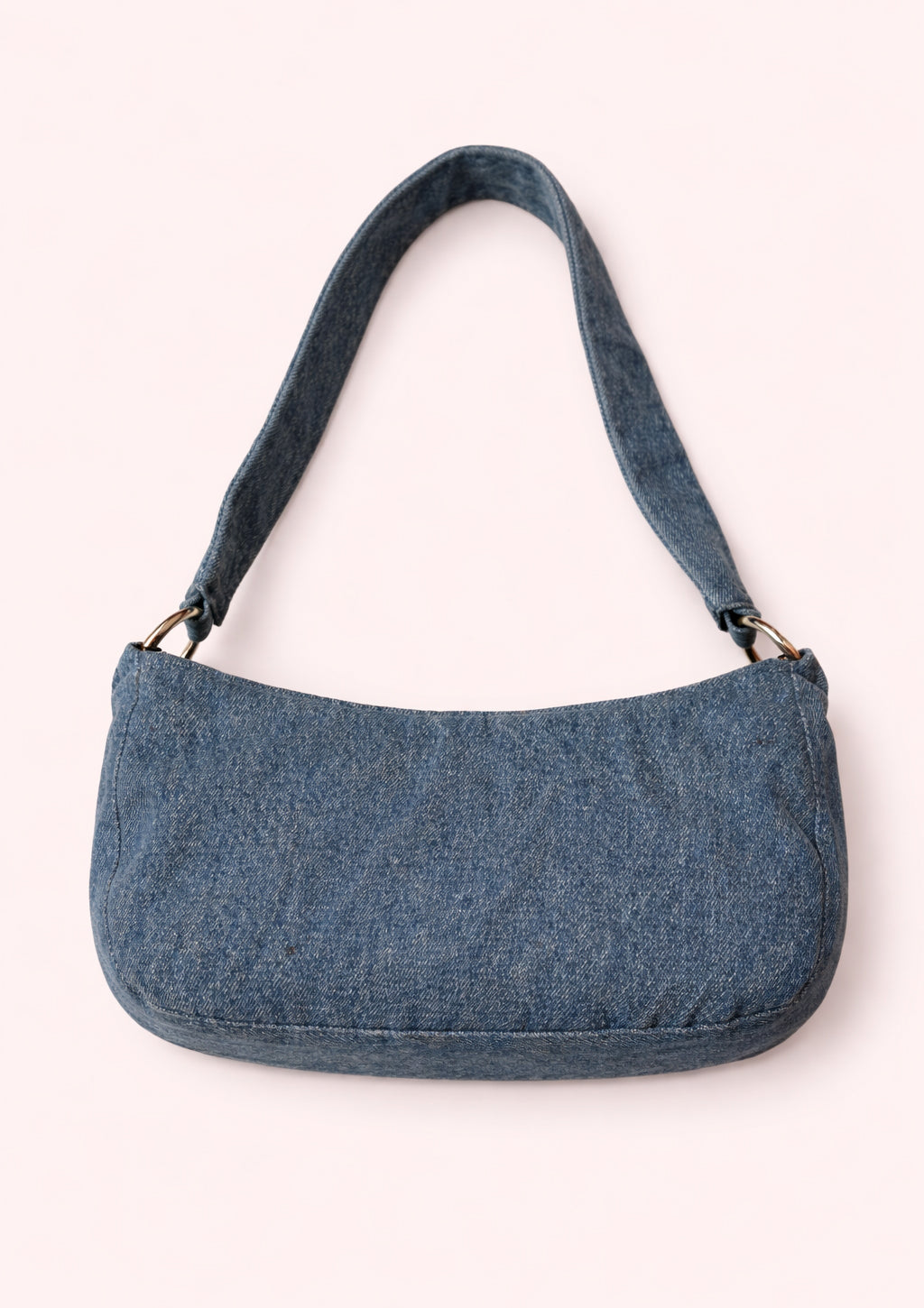 Blue denim handbag on a white background