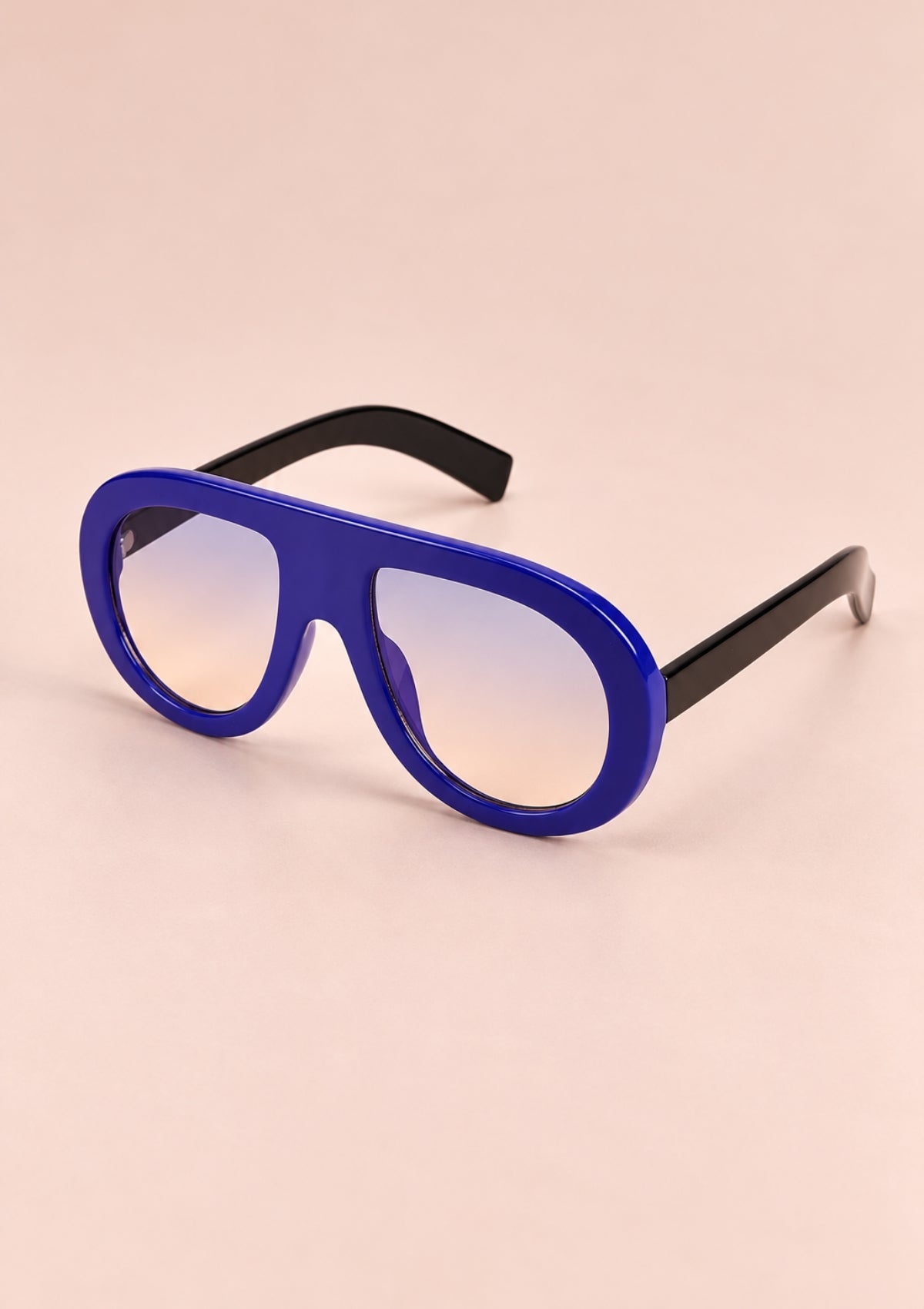 Blue oversized retro sunglasses with a bold frame and black temples