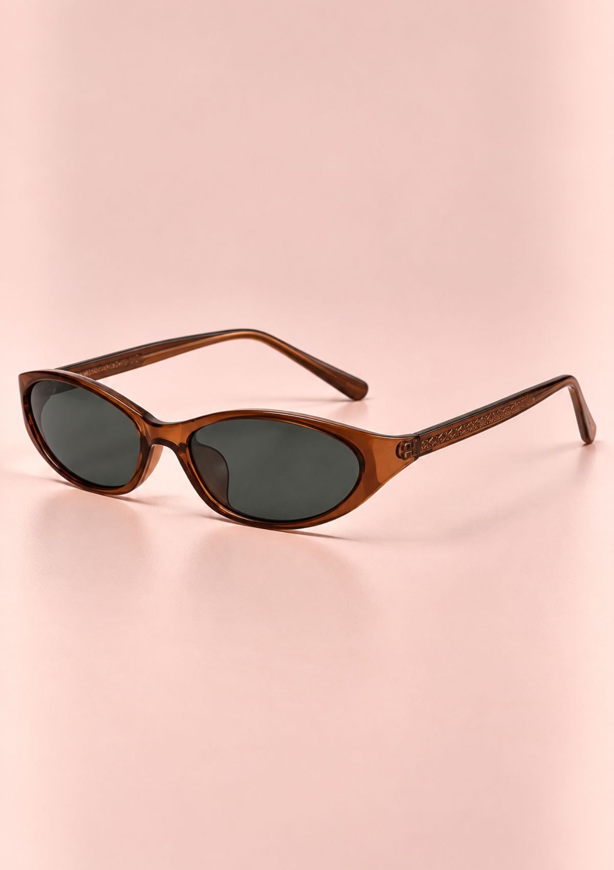 Brown cat-eye sunglasses with slim frame and dark green lenses