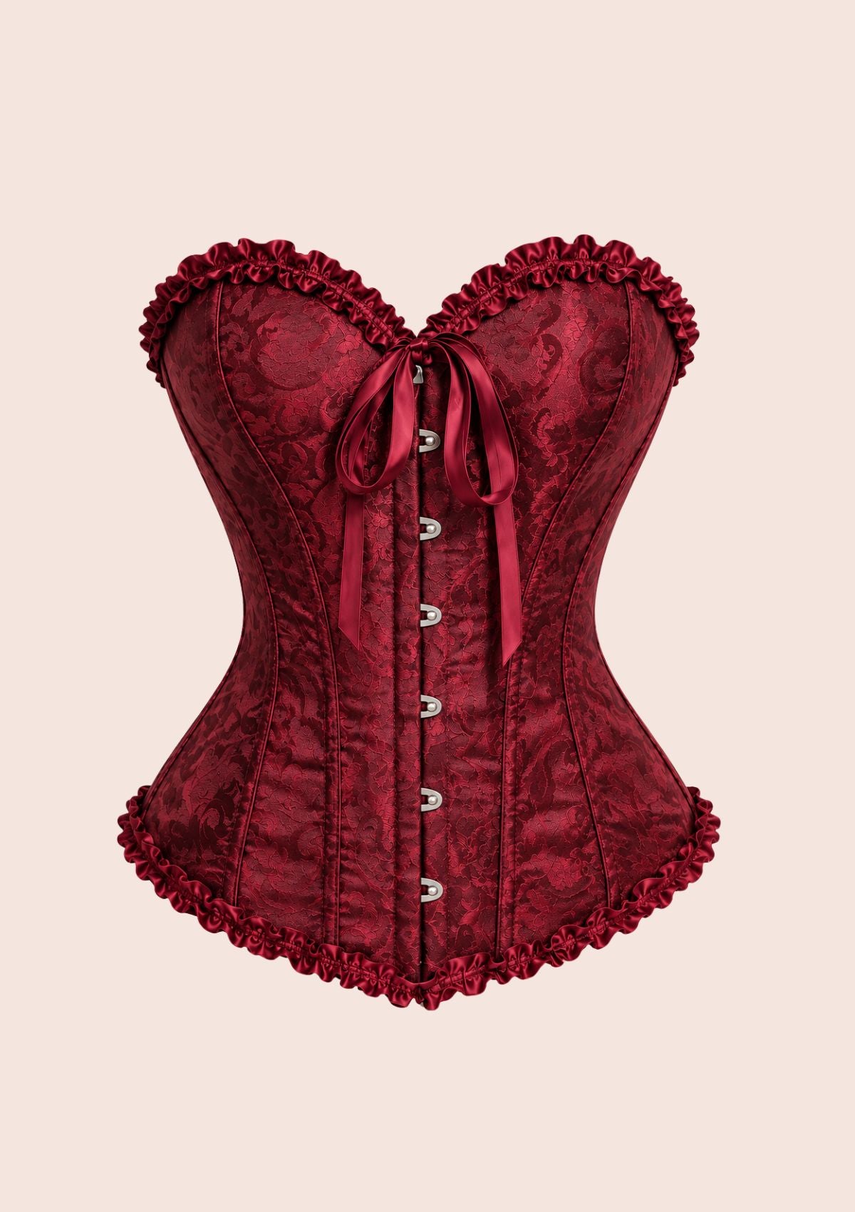 A deep burgundy red corset with a textured jacquard pattern, featuring ruffled trim along the sweetheart neckline, waist, and hem, a front tie bow, and silver metal buttons down the center, set against a solid pale beige background.