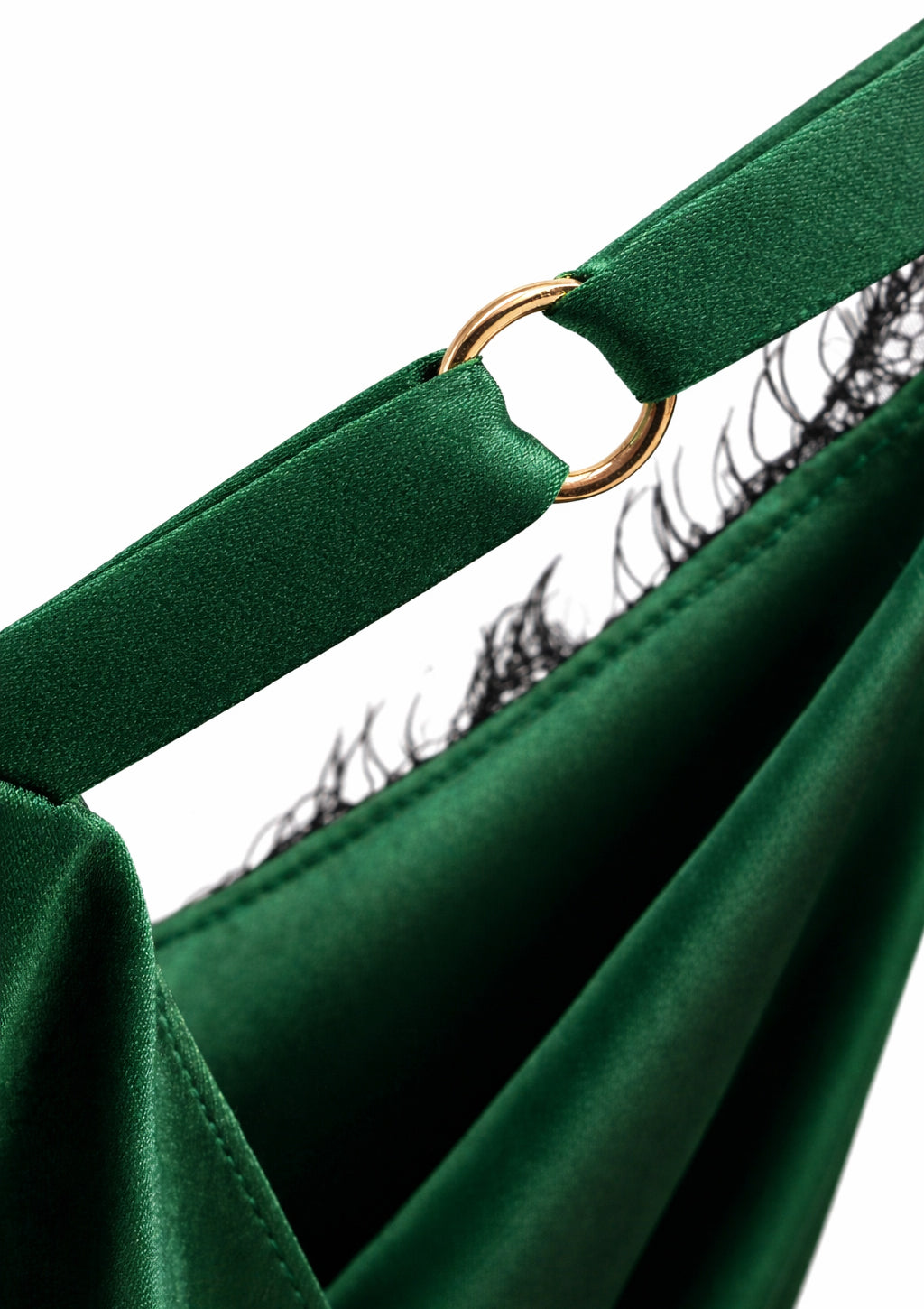 Close-up of a green strap dress on a white background