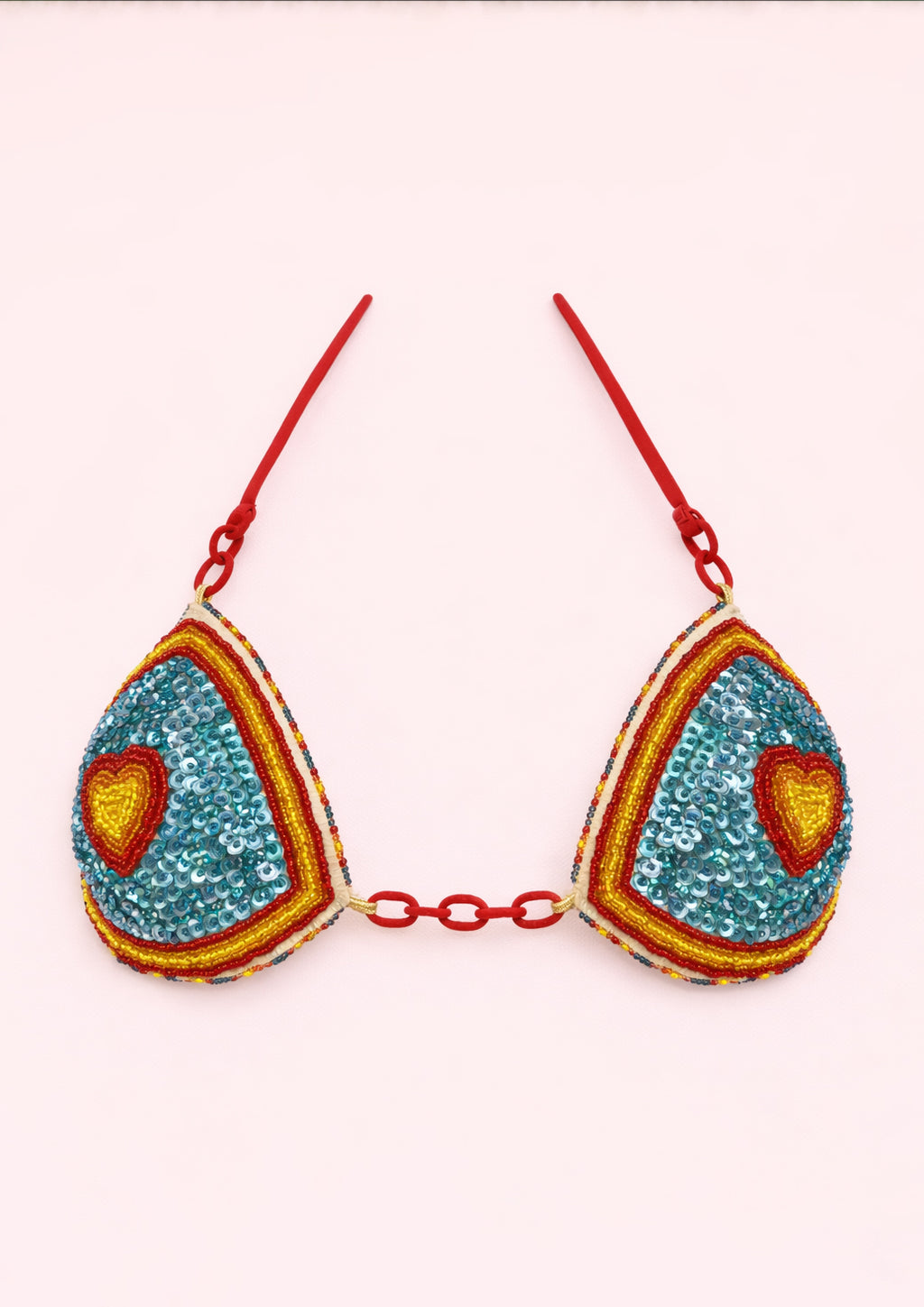 Colorful bra with heart designs on a white background