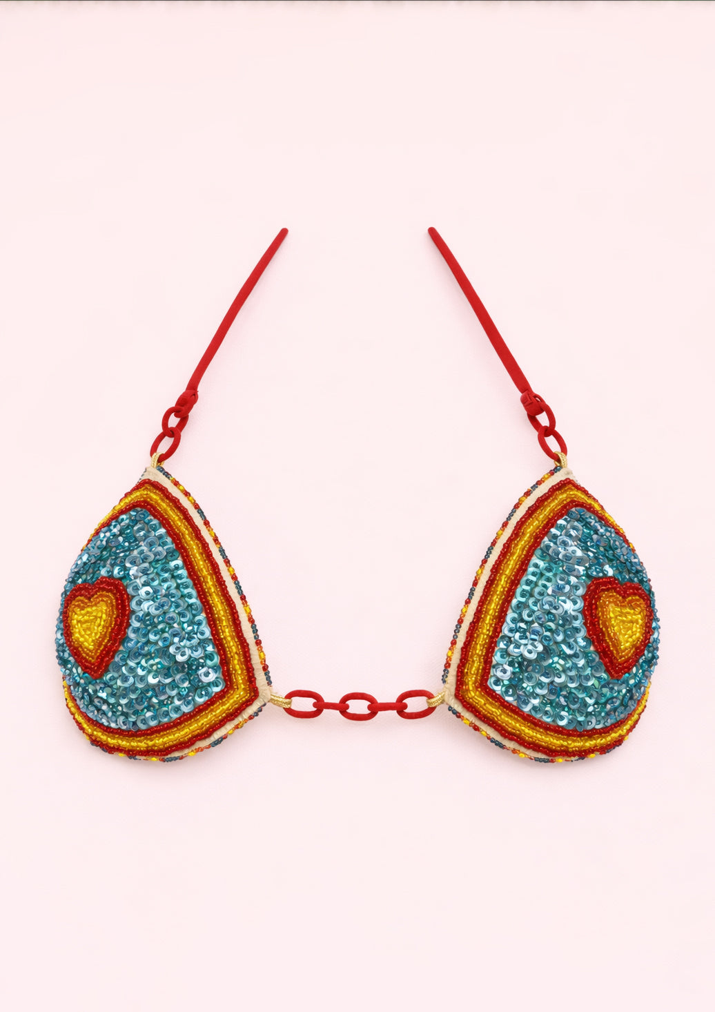 Colorful bra with heart designs on a white background