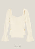 Cream-colored long-sleeve top with flared sleeves on a light gray background, featuring 'festival guru' branding.