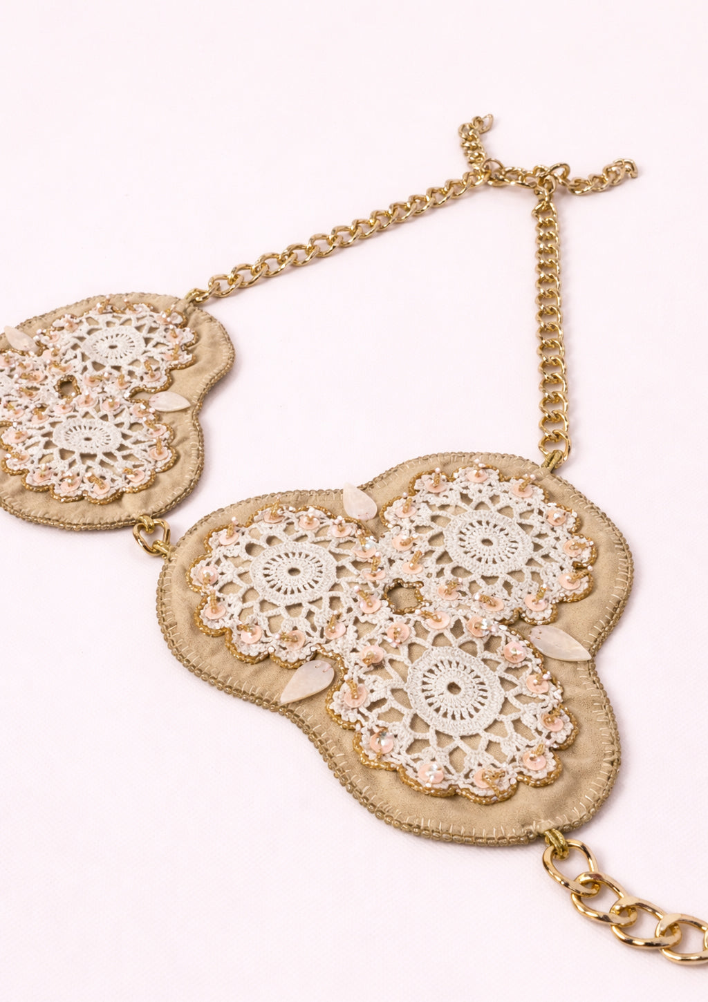 Decorative bra top with floral patterns on a white background