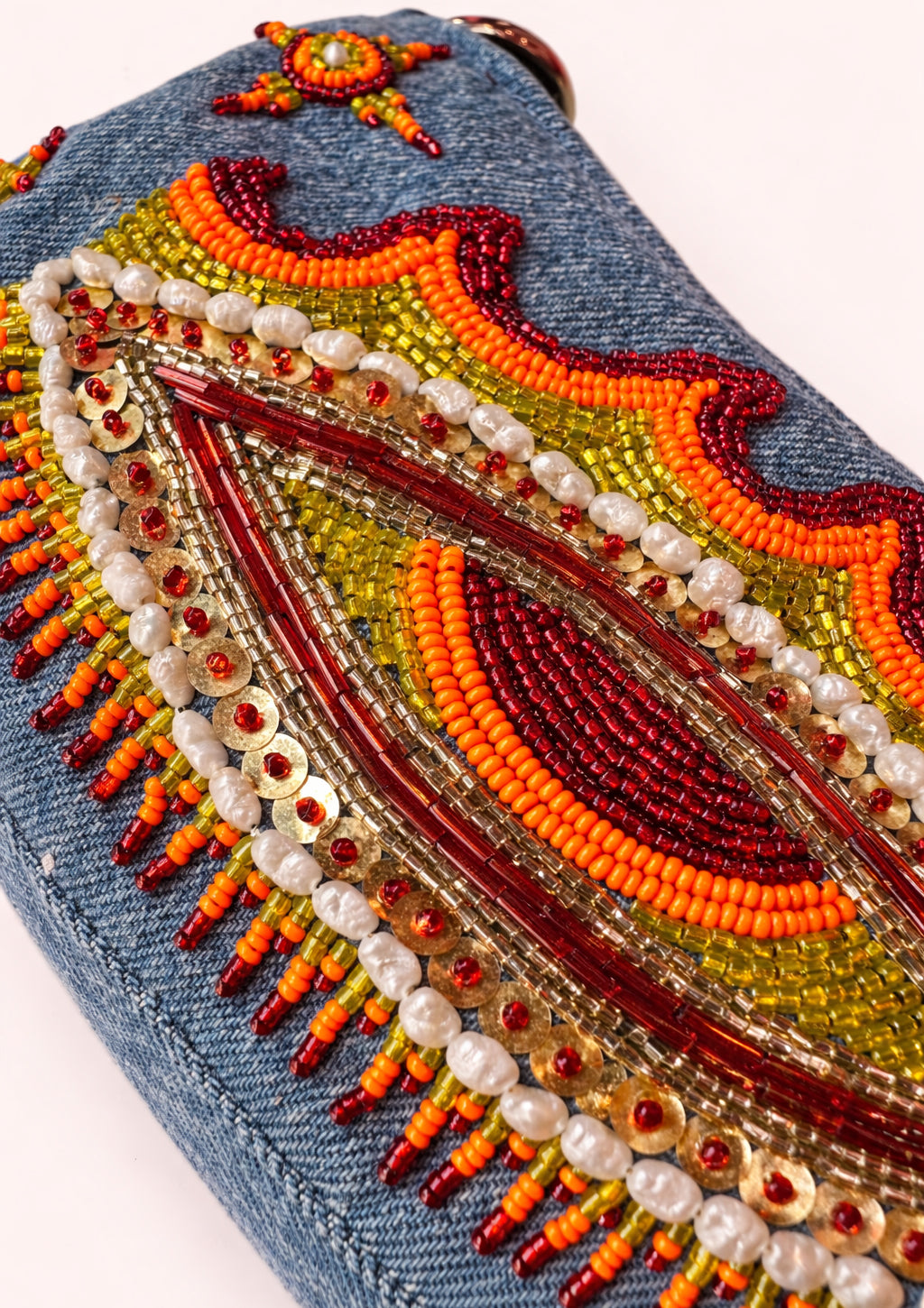 Decorative clutch with beadwork on a white background