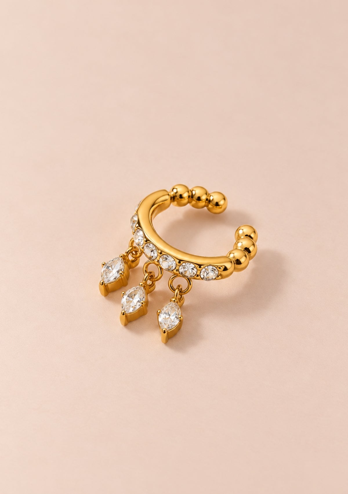 Gold zircon ear cuff with three dangling crystal details