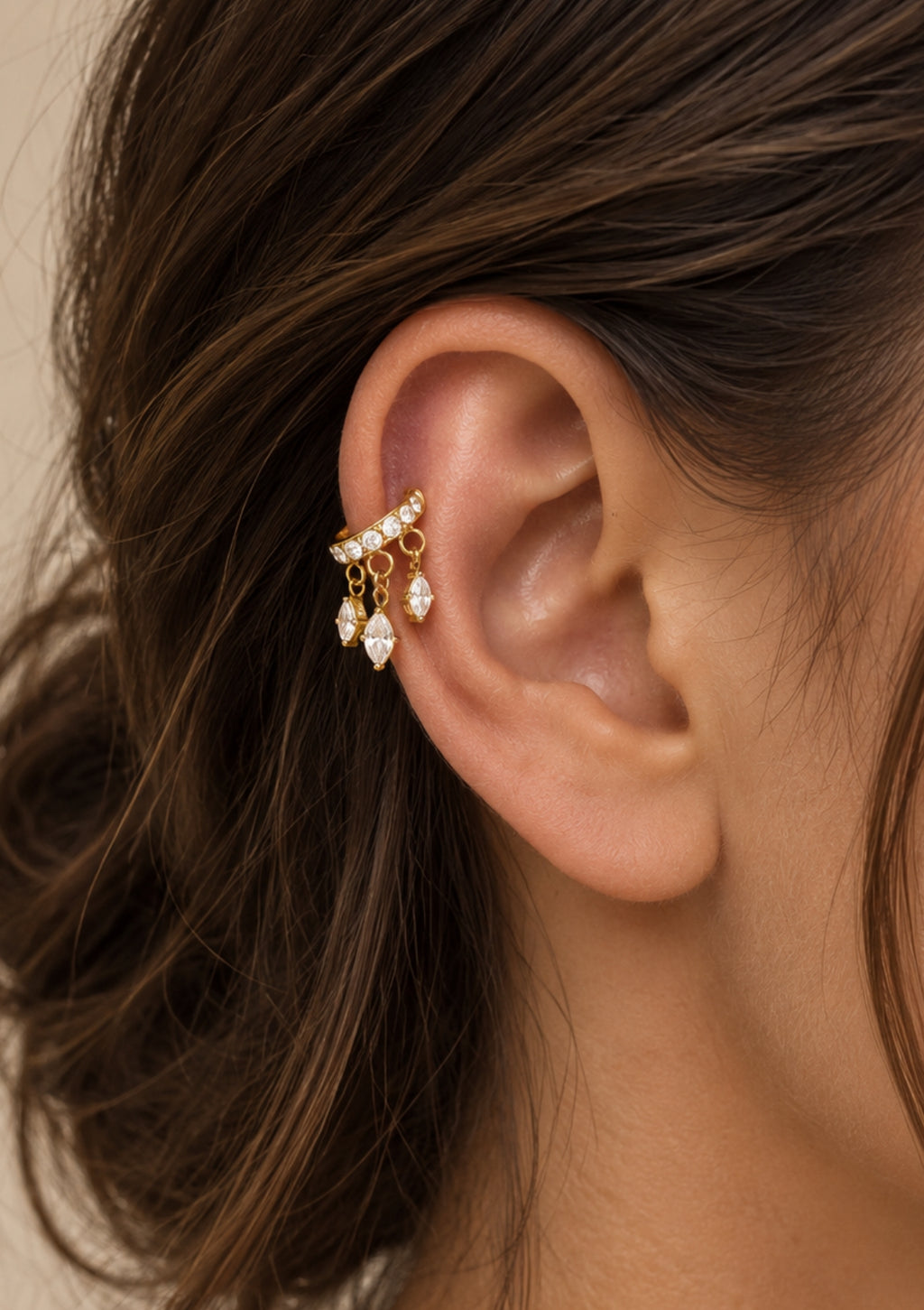 Gold zircon tassel ear cuff worn on the ear