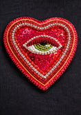 Load image into Gallery viewer, Heart-shaped patch with eye design on a black background
