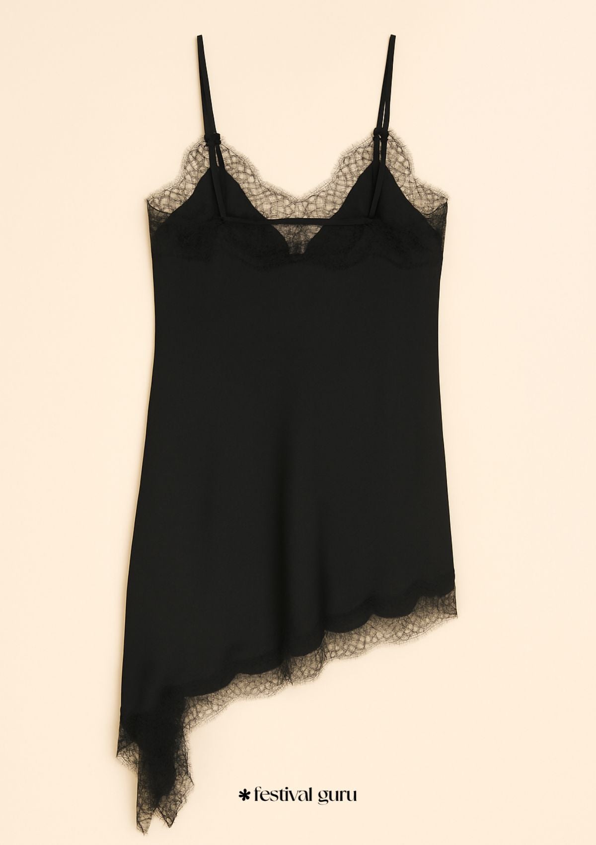 Lace black dress with lace trim on a beige background