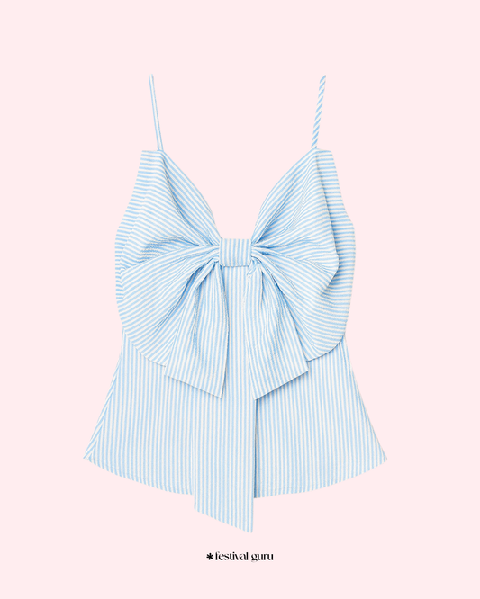 Light blue striped top with a large bow on a pink background