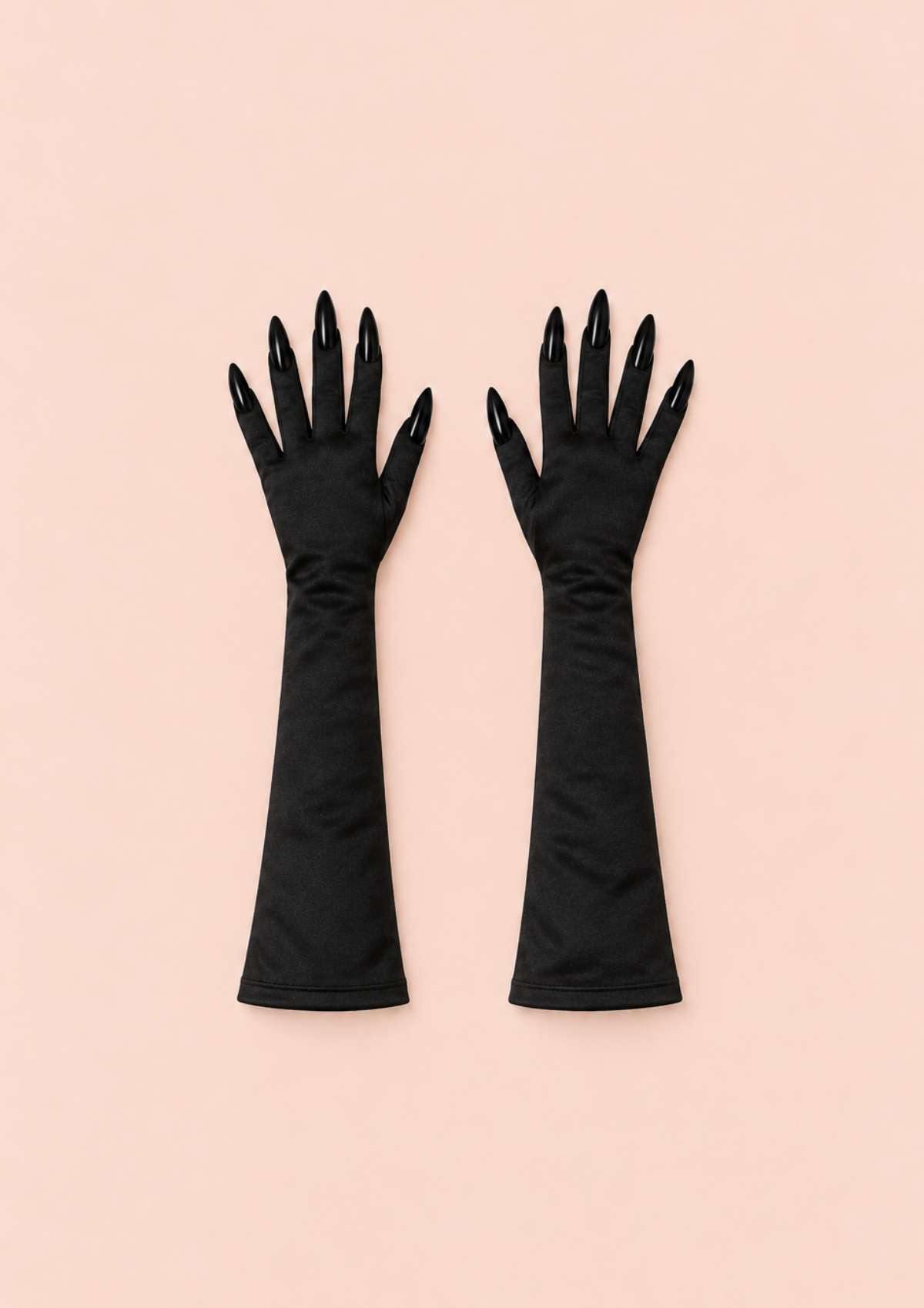 Long black gloves with pointed decorative claws, covering the forearms, displayed on a pale pink background