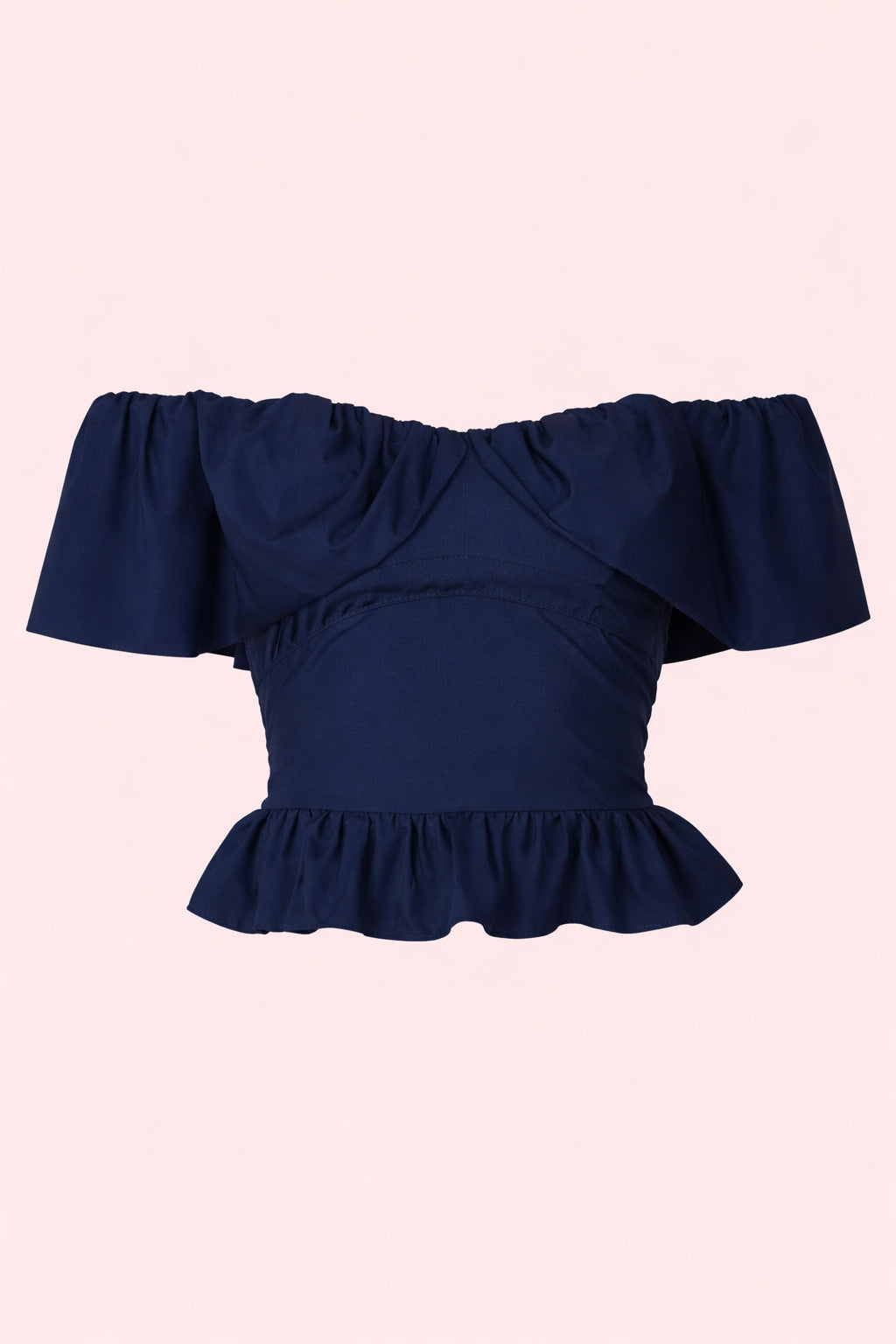 Navy blue off-shoulder top with ruffled details on a light pink background