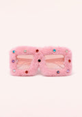 Pink fluffy sunglasses with decorative elements on a white background