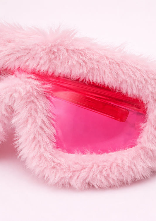Pink fluffy sunglasses with a clear plastic window on a white background