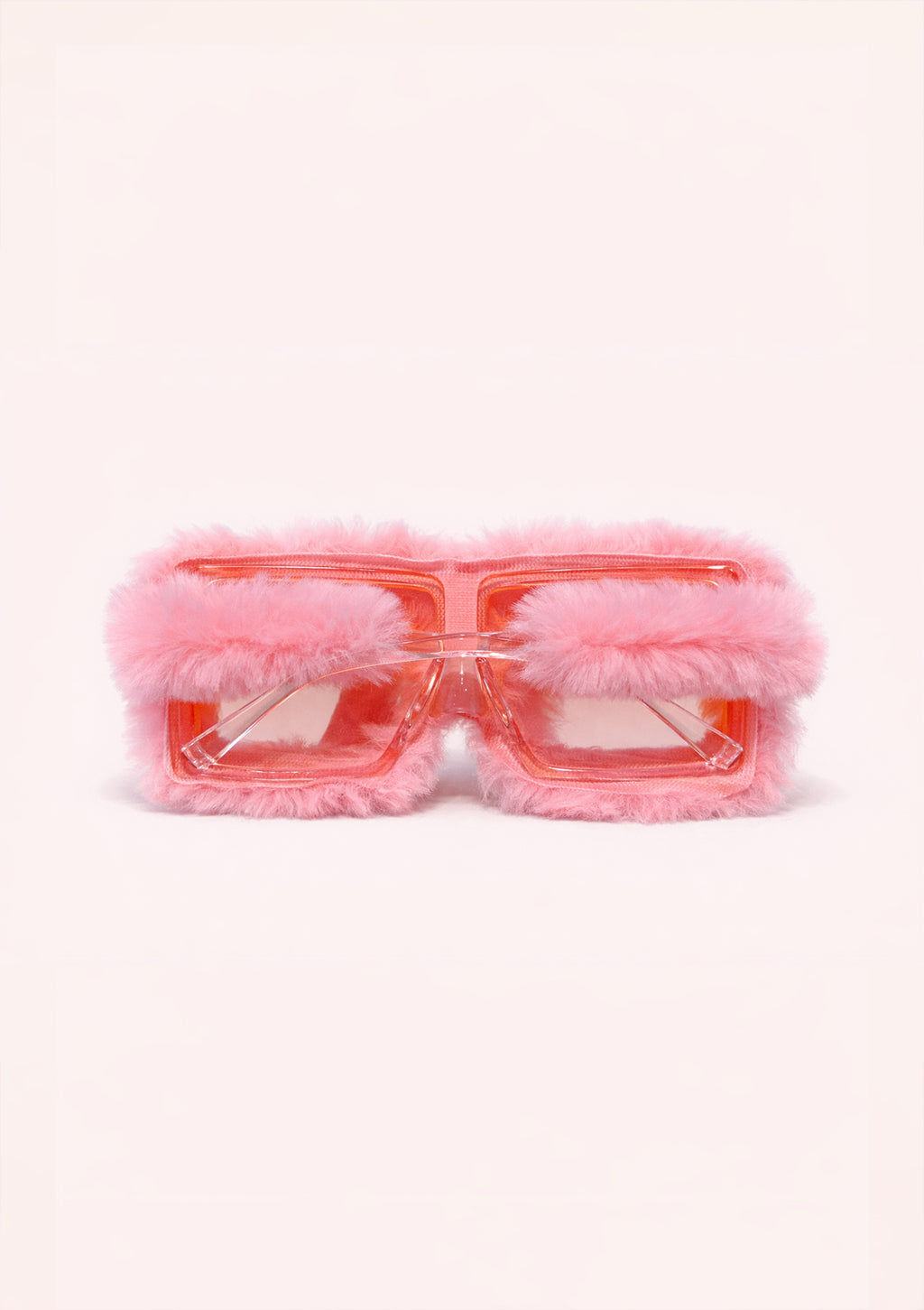 Pink sunglasses with fluffy rims on a white background