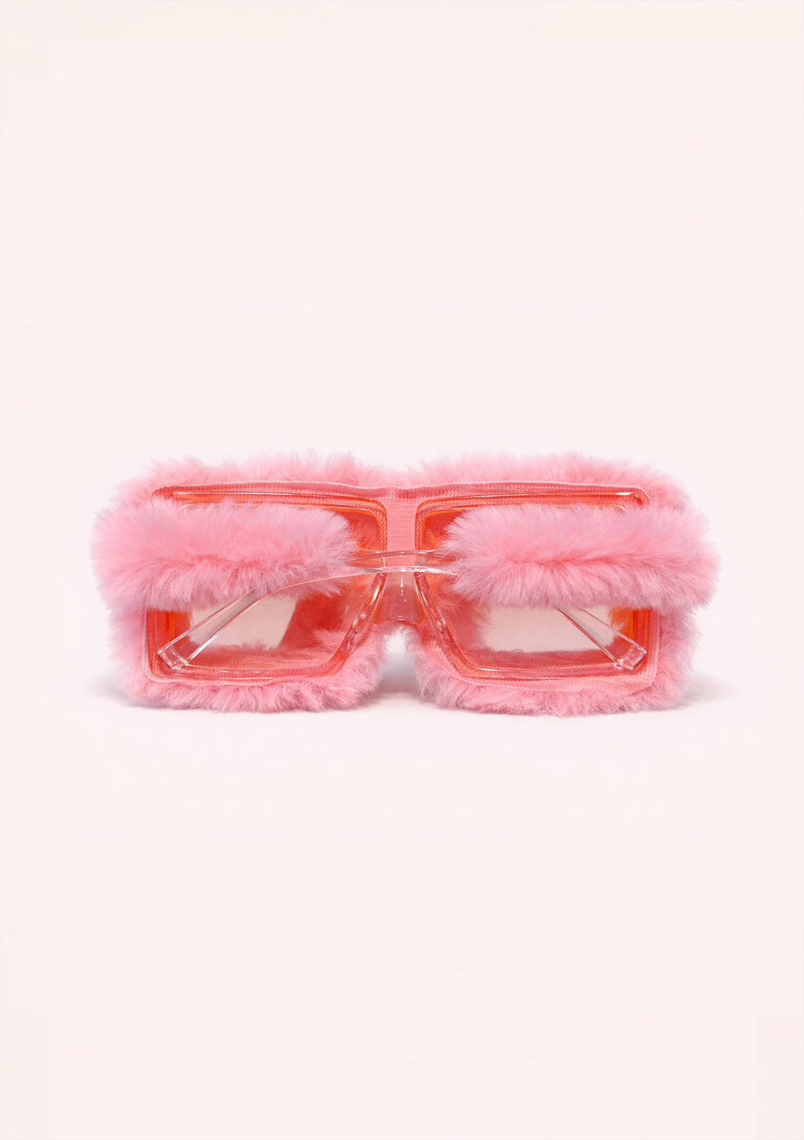 Pink sunglasses with fluffy rims on a white background