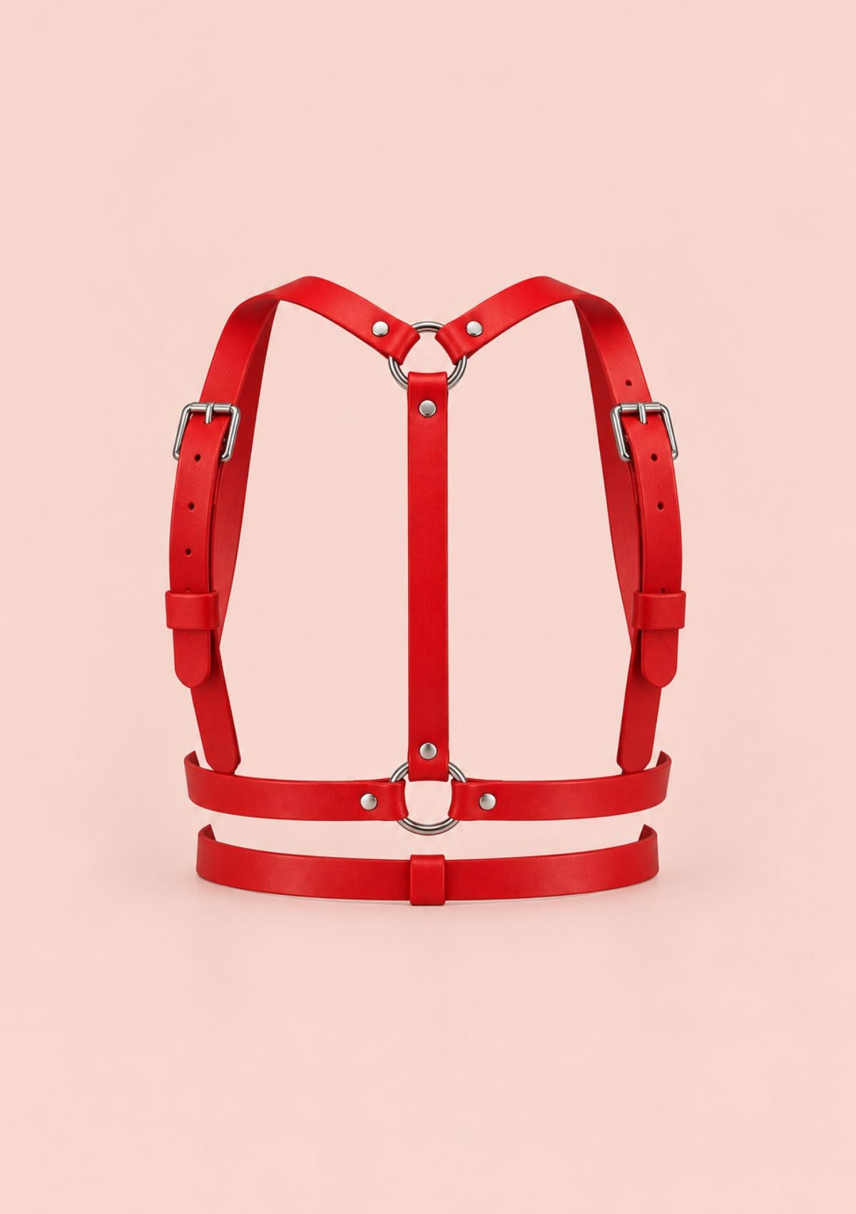 Red leather-look harness top belt with criss-cross straps, metal rings and adjustable buckles