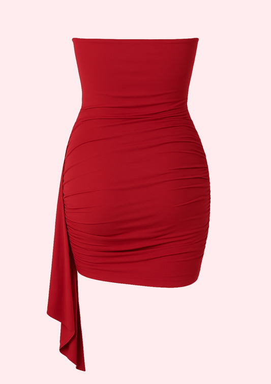 Red dress with a draped design on a white background