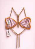 Заредете изображението в програмата за преглед на галерия, Pink bralette with gold chains on a pink background
