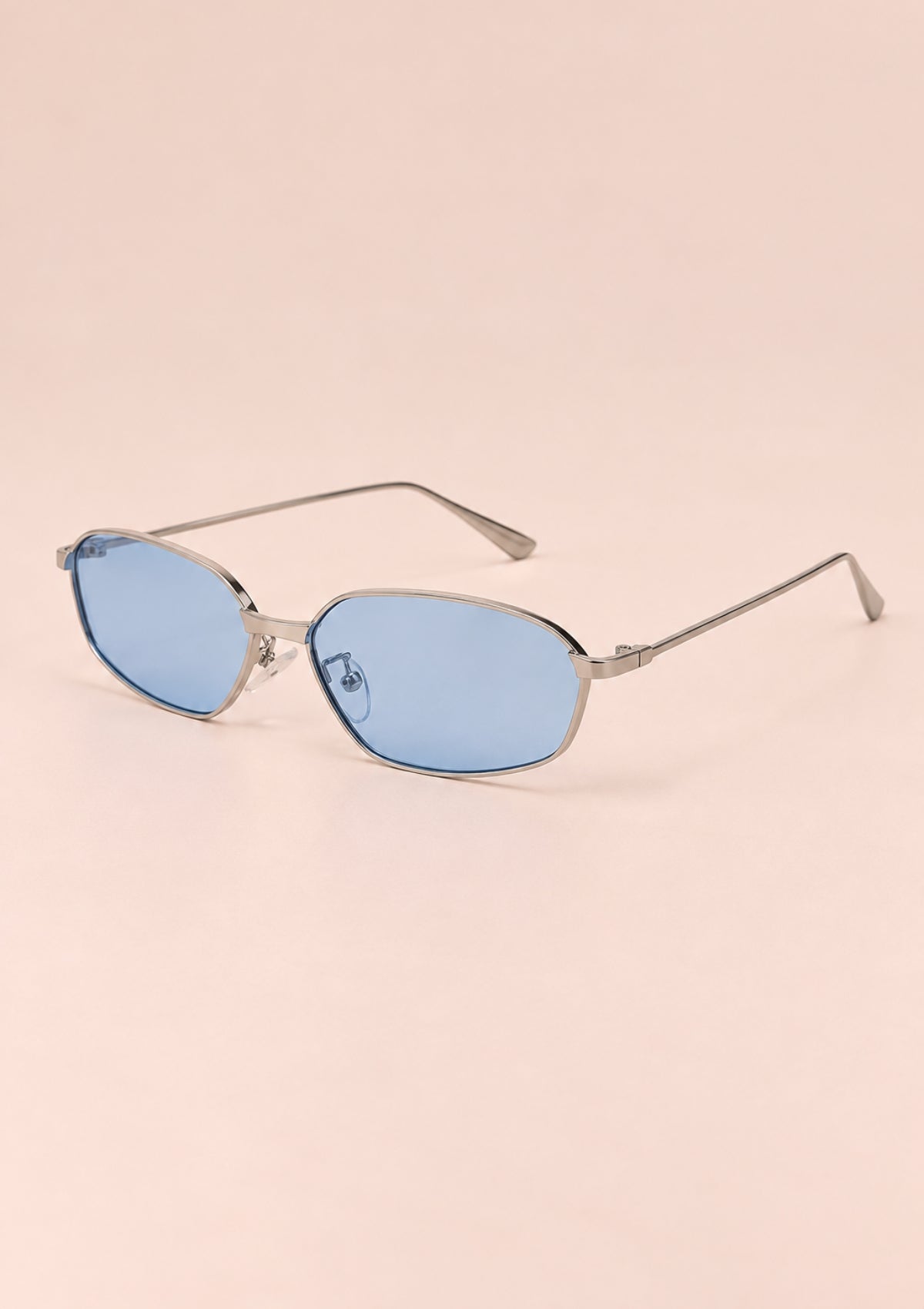 Silver women's cat-eye sunglasses with a slim metal frame and light blue lenses